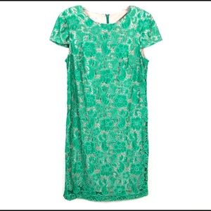 Jade colored lace dress. Completely lined in nude color fabric. Short sleeve.